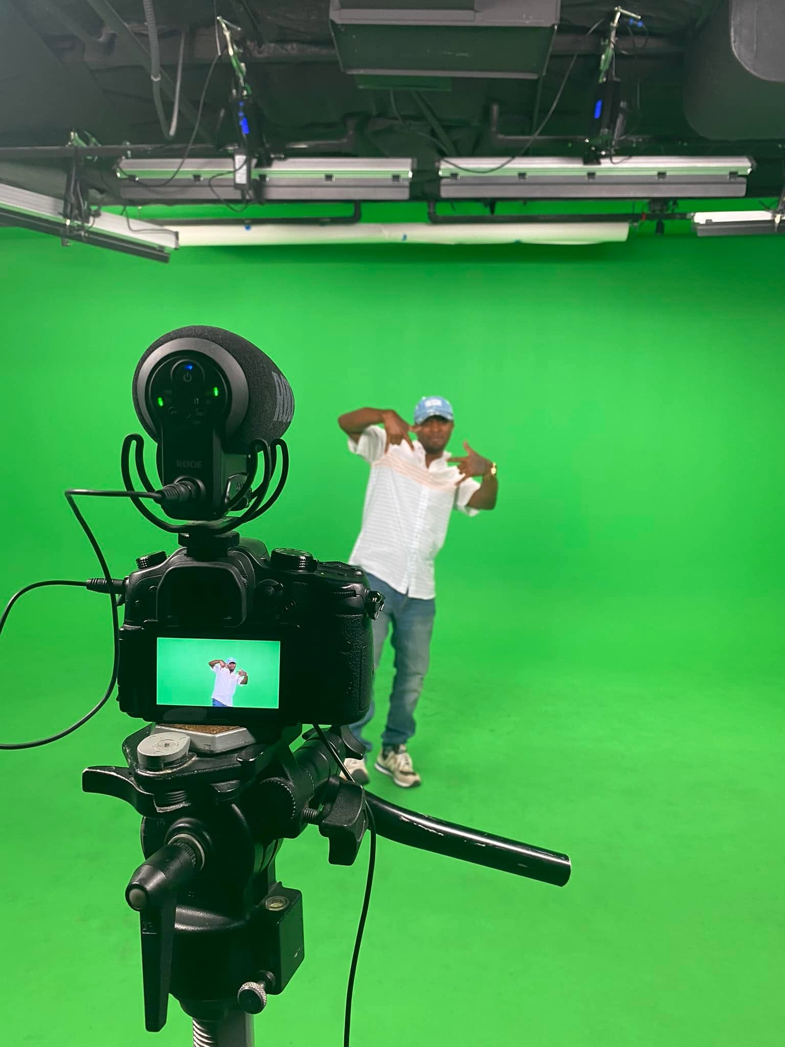 Digital Cheese Productions camera filming talent inside a professional green-screen studio