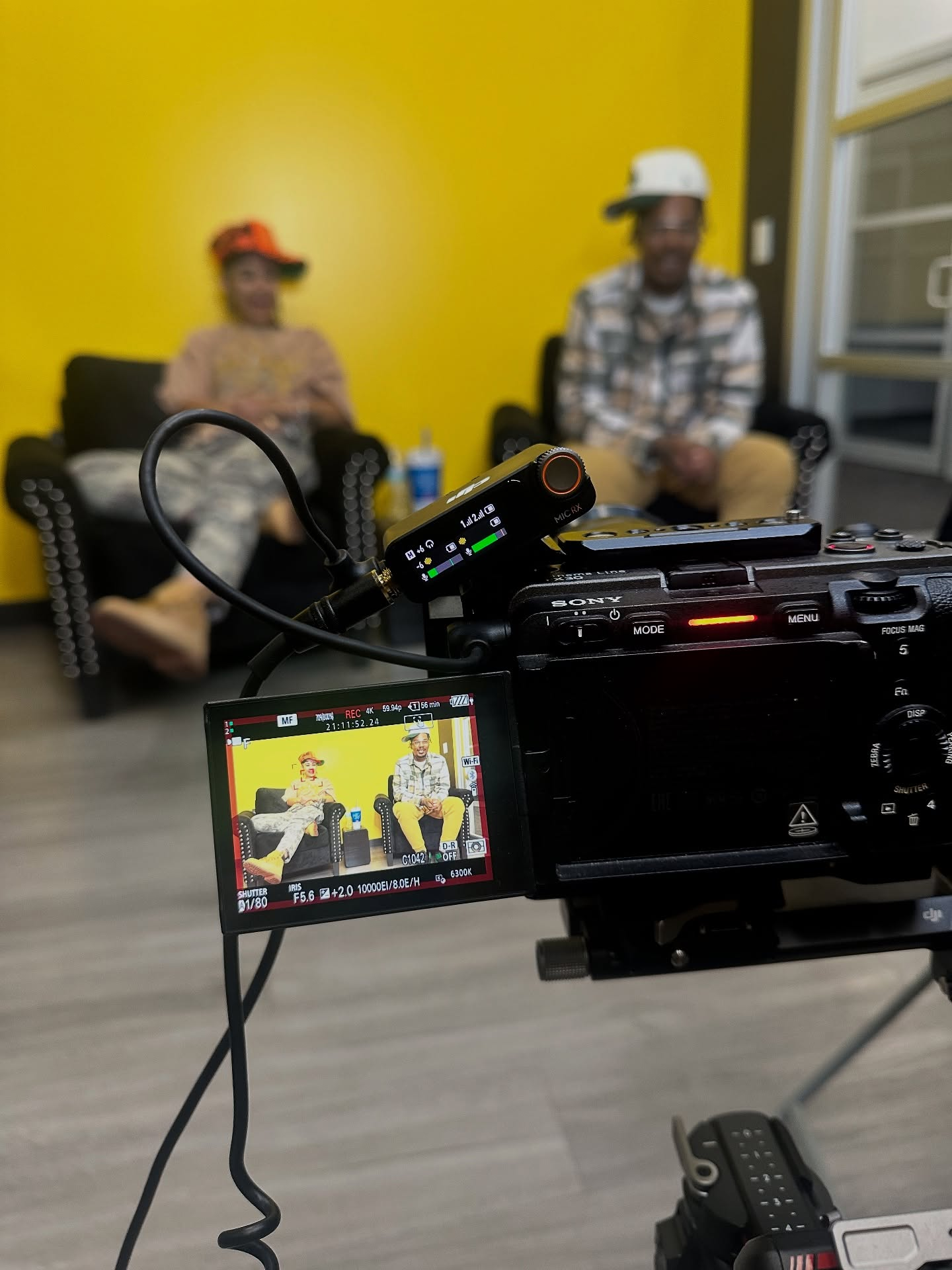 Digital Cheese Productions camera and audio setup filming a two-person interview